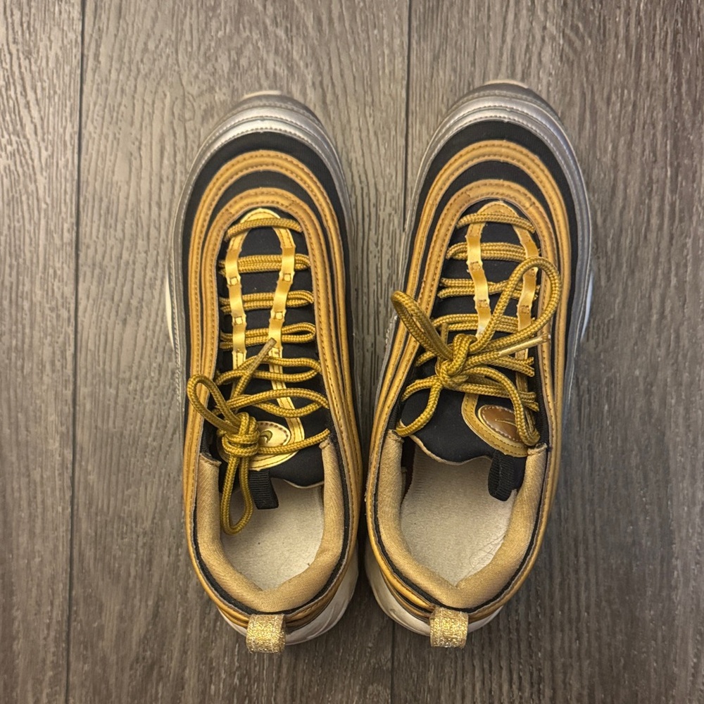 Stylish Women’s Silver, Black, and Gold Nike’s